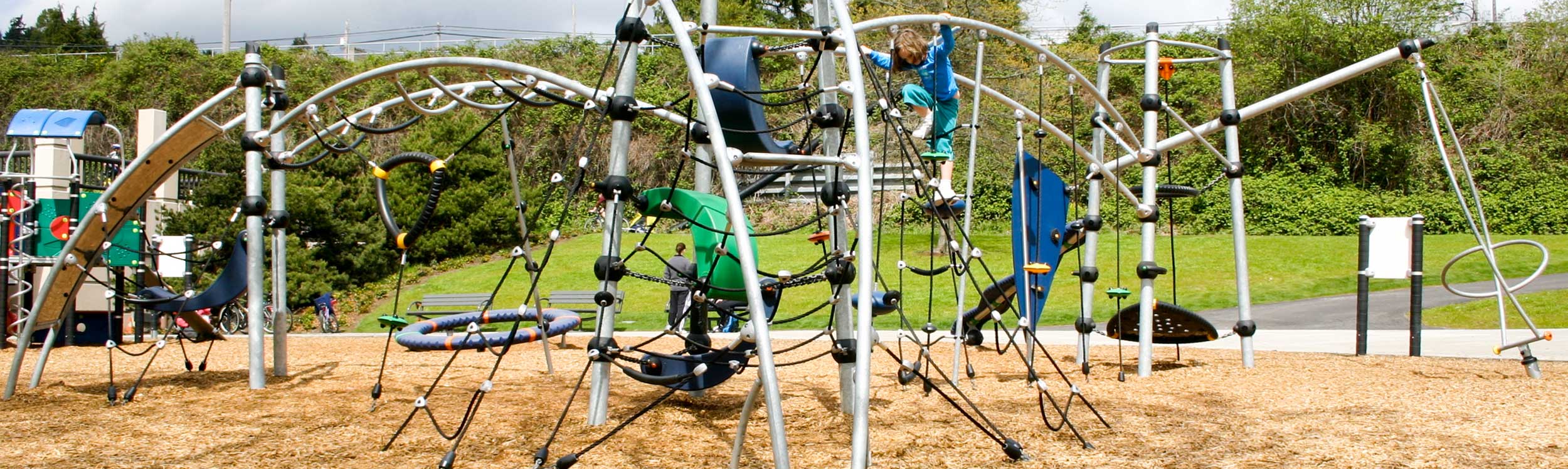 Modern swing, rope climber and spinner playground